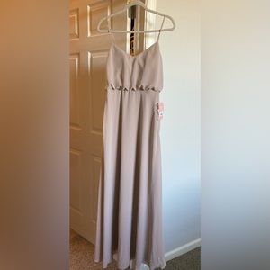 Long taupe colored dress.
